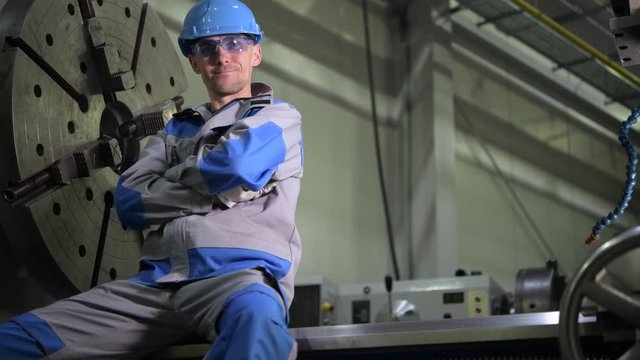 Metal Processing Industry Engineer Portrait. 4K Footage with Motion. Caucasian CNC Operator.