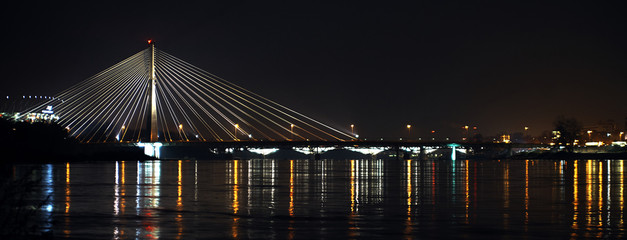 Fototapeta na wymiar Night view at the Holy Cross Bridge in Warsaw