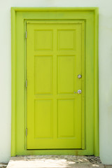 Painted Green Closed Door on White Wall