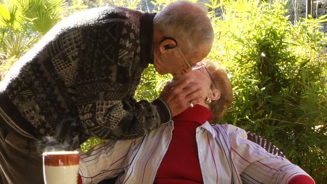 Elderly older couple morning kiss