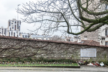 Communards Wall (Mur des Federes) with a memorial plaque in French to the deceased ones of Commune)...