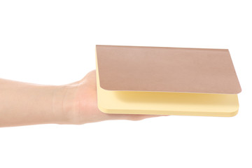 Notepad diary in hand