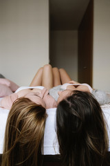 Fototapeta premium Unrecognizable friends relaxed in the bedroom.