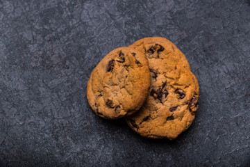 Oatmeal and Chocolate Cookies on Dark Background