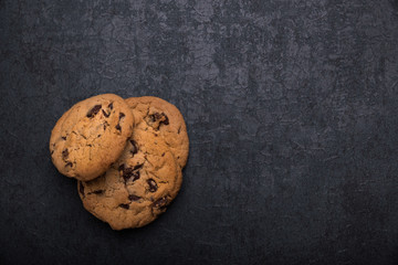 Oatmeal and Chocolate Cookies on Dark Background
