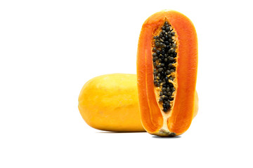 Whole and half of ripe papaya fruit with seeds isolated on white background with copy space. Natural source of vitamin C, folate and minerals. Healthy food for pregnant and breast feeding woman