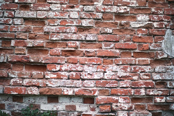 Old brick wall with a crack