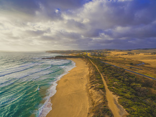 Magnificent ocean coastline with yellow sand beach and rural areas. Kilcunda, Victoria, Australia