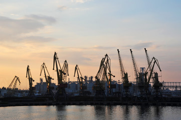 Port cargo crane at sunset