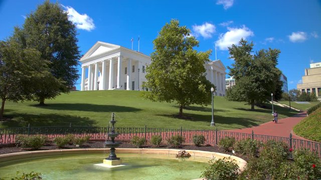 Richmond VA State Capitol House And General Assembly Square Viewed Over The Water Fountain During A Sunny Day In The Commonwealth