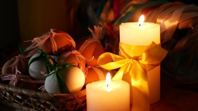 Easter decoration. Burning candles and eggs