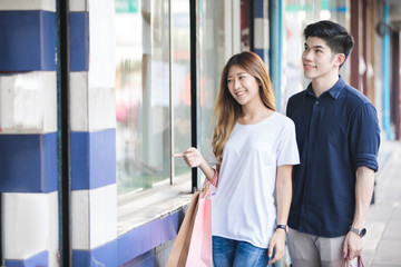 Young asian couple shopping
