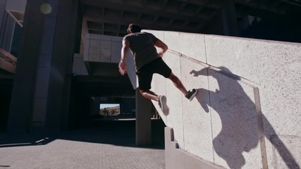 Free runners performing parkour in urban space. People doing parkour tricking and freerunning in the city.  - Powered by Adobe