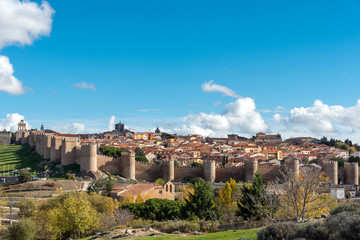 Fototapeta na wymiar View of Avila in Spain with the famous surrounding city wall