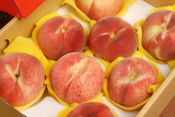 Fresh  peaches in the box ready for sale