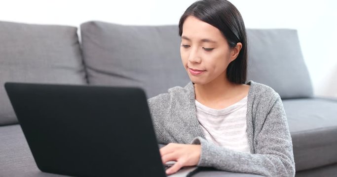 Woman using notebook computer for online