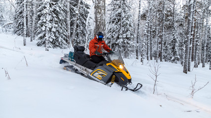 Athlete on a snowmobile.