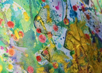 Colorful vivid painting watercolor abstract background in golden hues and colors