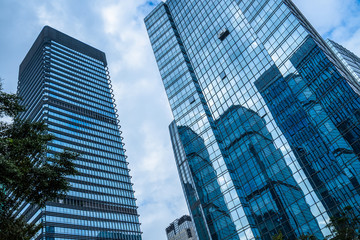 Fototapeta premium Architecture details Modern Building Glass facade Business background.