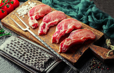 Raw meat on the old background