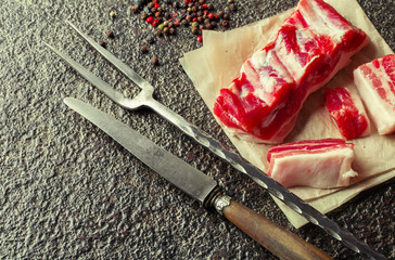 Raw meat on the old background