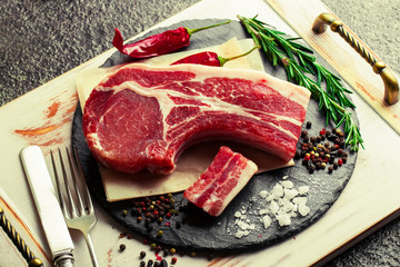 Raw meat on the old background