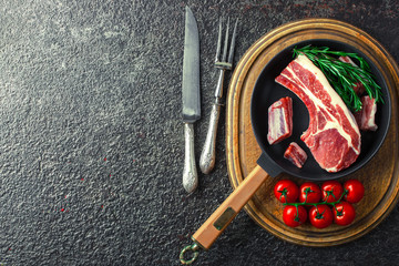 Raw meat on the old background