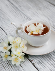 Cup of tea with jasmine flowers
