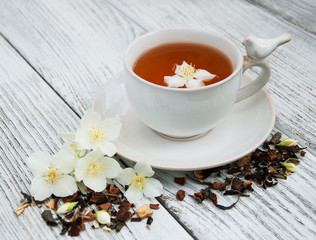 Cup of tea with jasmine flowers