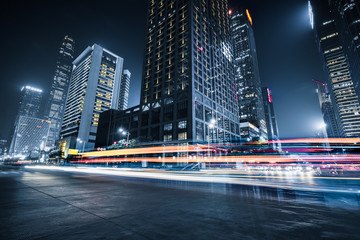 Fototapeta na wymiar the light trails on the modern building background.