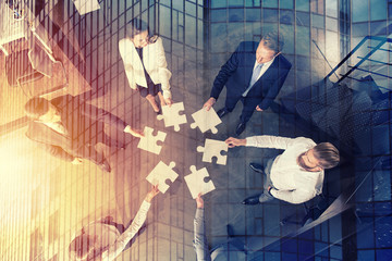 Teamwork of partners. Concept of integration and startup with puzzle pieces