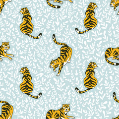 Naklejka premium Vector seamless pattern with tigers and triangles isolated on the white background. Animal background for fabric or wallpaper boho design.