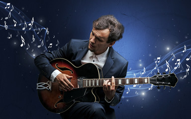 Obraz premium Lonely composer playing on guitar