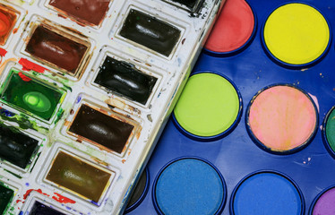 creative background from the sets of bright paints watercolors of various