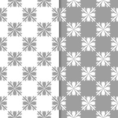 White and gray floral backgrounds. Set of seamless patterns
