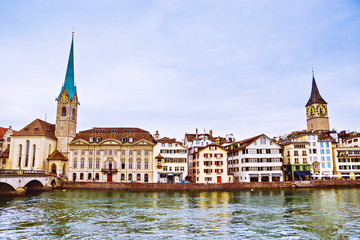 View of the historic city center of Zurich with famous Fraumunster Church and munsterbrucke with...