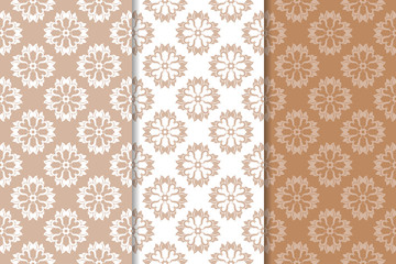 Brown floral backgrounds. Set of seamless patterns