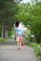Portrait of a beautiful young girl on nature