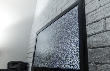 Tv screen with noise glitcher effect. No signal or no communication concept with rustic or loft style innterior.