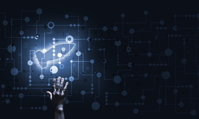 Technology idea concept with glowing rocket icon and touching it finger