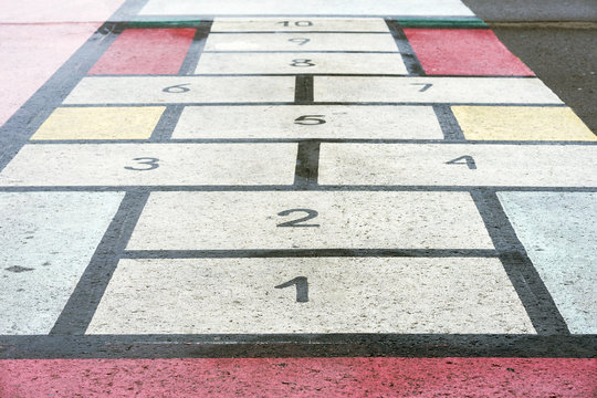 Classiic children game, hopscotch board drawn on asphalt, texture, modern creative background