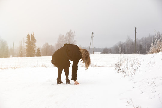 Slip on the slippery ice and snow on the road track at the country in freezing winter day.