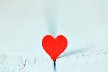 Heart on a wooden background. Background in the style of Valentine's Day. Heart on a wooden background