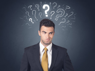 Businessman with question marks