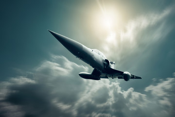 Fototapeta na wymiar Military airplan on the speed in the sky