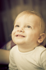 Portrait of a cute 2 year old boy being amazed