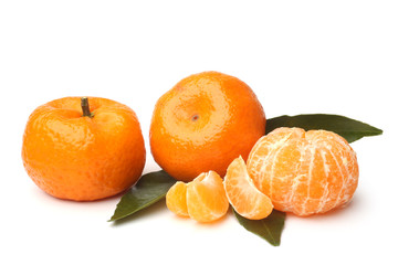 Ripe tangerines with green leaves
