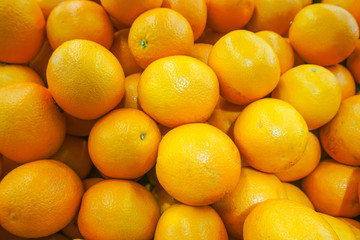 Pile of Fresh Navel Oranges are selling in supermarket