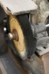 An old traditional brush at a grindery