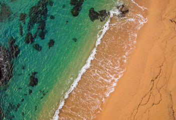 Fototapeta na wymiar Aerial views of the beach and the waves in the Mediterranean.
